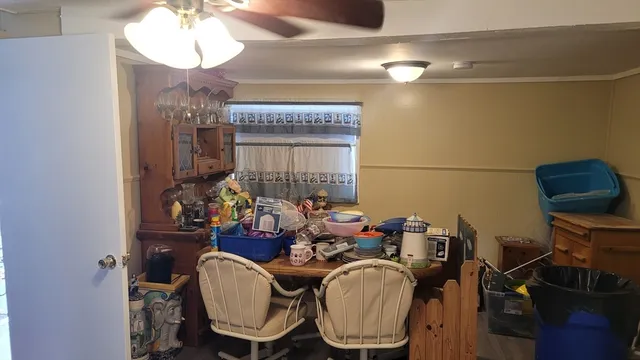 a dining room with furniture and wooden floor