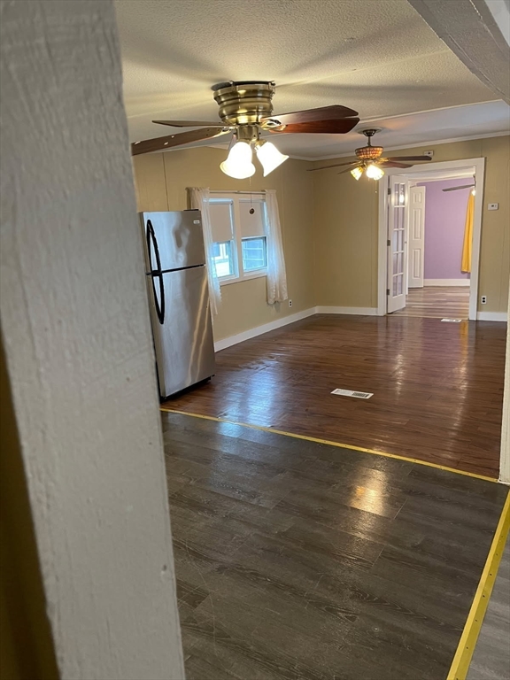 252 Newbury Street, Unit 71 Peabody, MA 01960 - Photo 20 of 22 a view of a room with wooden floor and chandelier