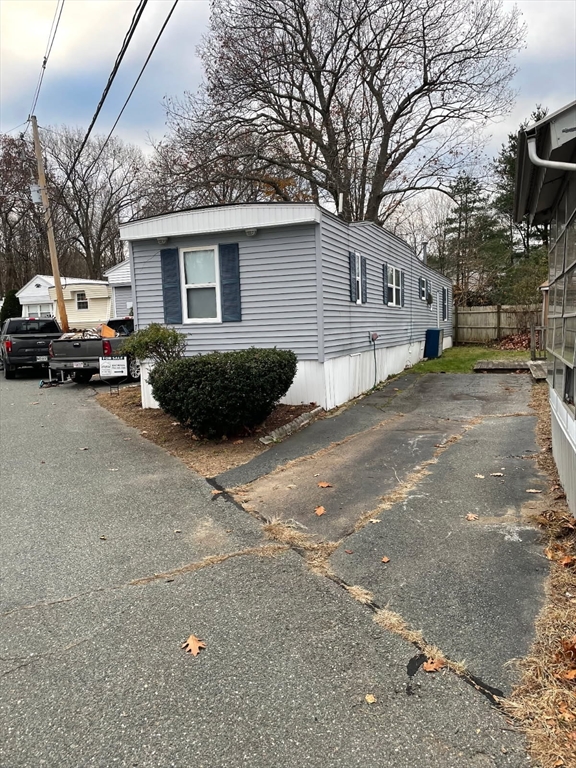 252 Newbury Street, Unit 71 Peabody, MA 01960 - Photo 22 of 22 a view of a house with a yard