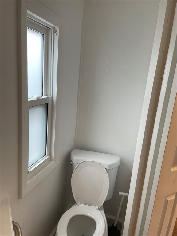 252 Newbury Street, Unit 71 Peabody, MA 01960 - Photo 4 of 22 a white toilet sitting next to a window
