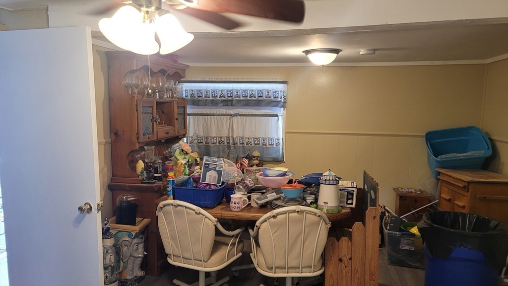 252 Newbury Street, Unit 71 Peabody, MA 01960 - Photo 6 of 22 a dining room with furniture and wooden floor