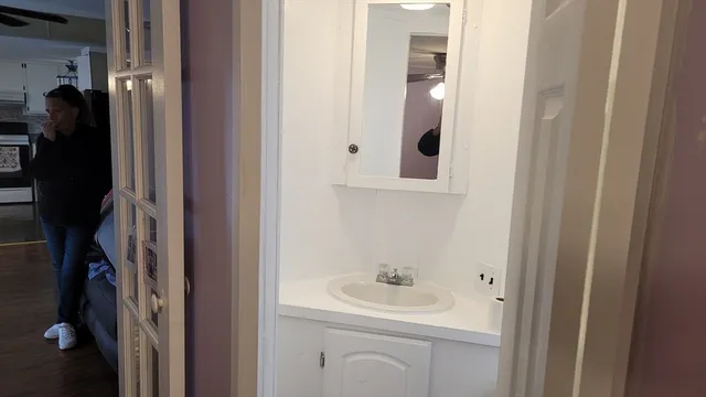 a bathroom with a sink and mirror