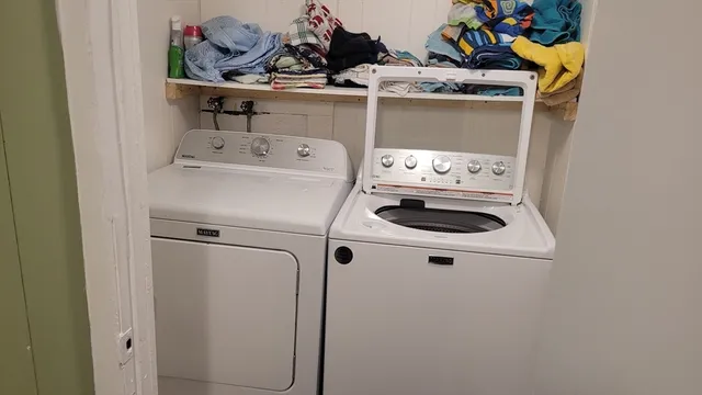 a utility room with dryer and washer