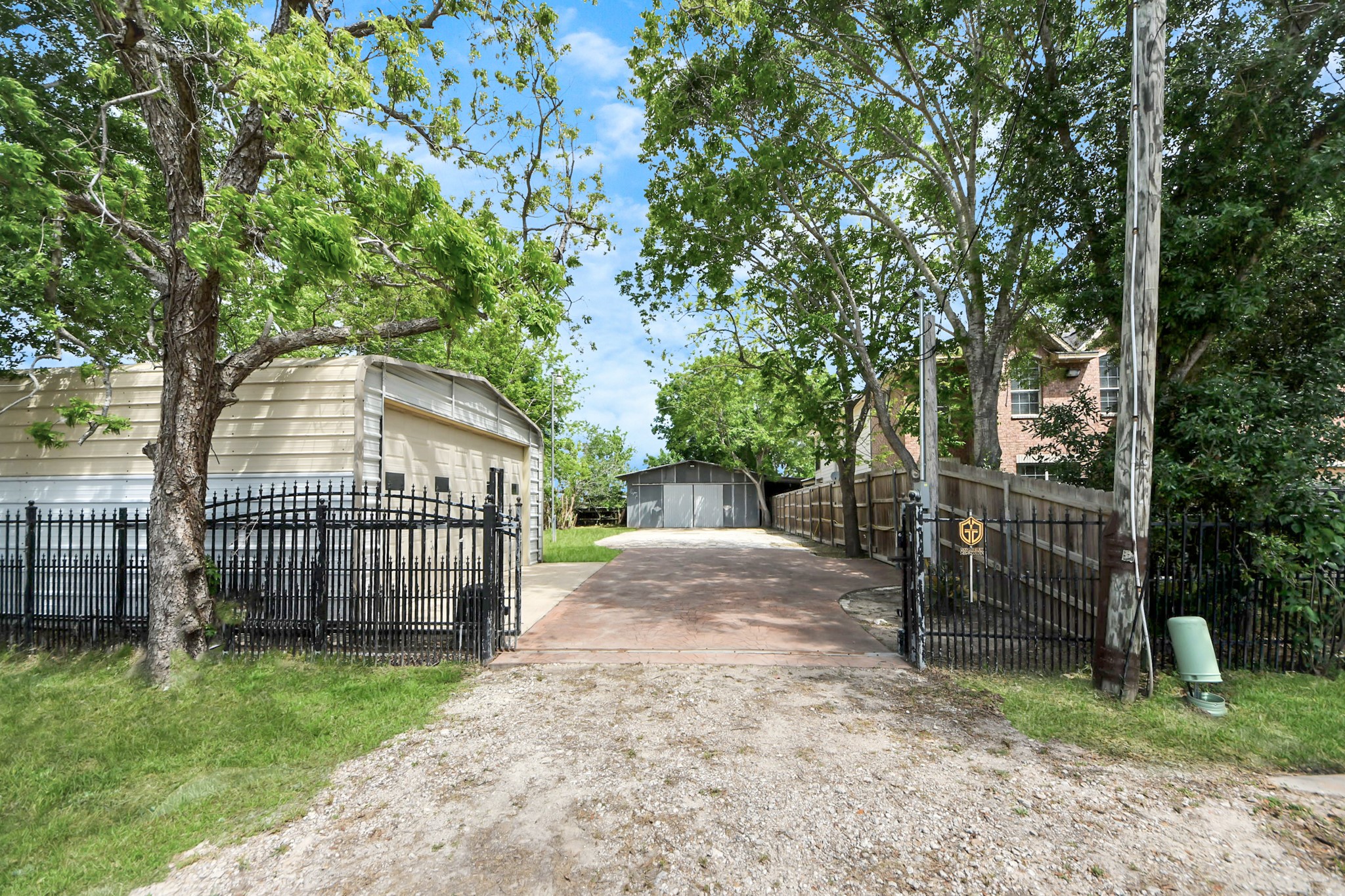 704 Cleo Street Fresno, TX 77545 - Photo 17 of 40 a view of a house with a backyard and a patio