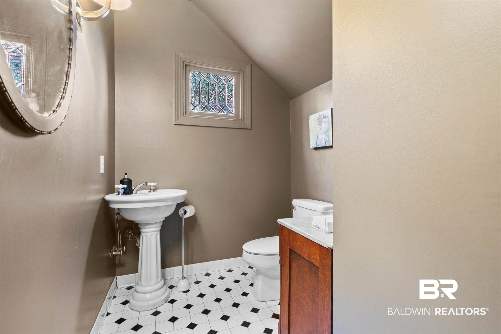 3615 Stein Street Mobile, AL 36608 - Photo 18 of 44 Half bath featuring vaulted ceiling and light tile patterned floors