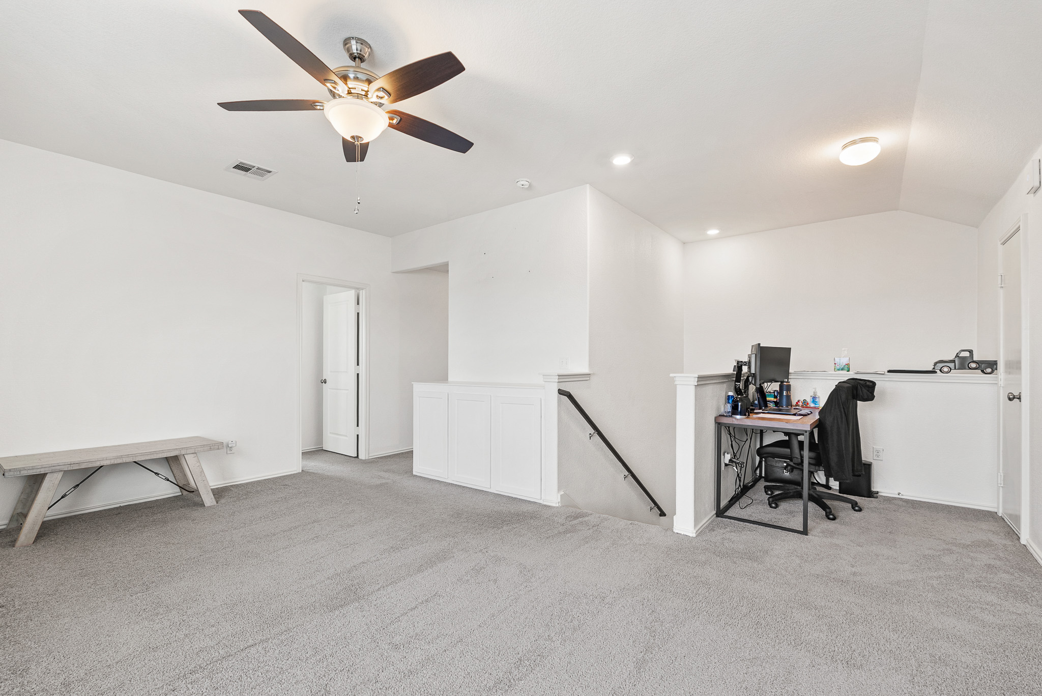 136 Copper Lane Kyle, TX 78640 - Photo 21 of 33 Office with light colored carpet, vaulted ceiling, recessed lighting, and ceiling fan