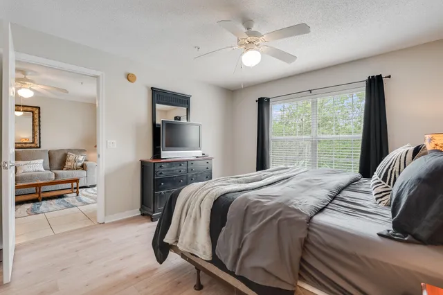 a bedroom with a bed and a table