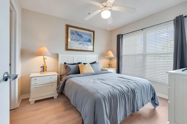 a bedroom with a bed and a lamp