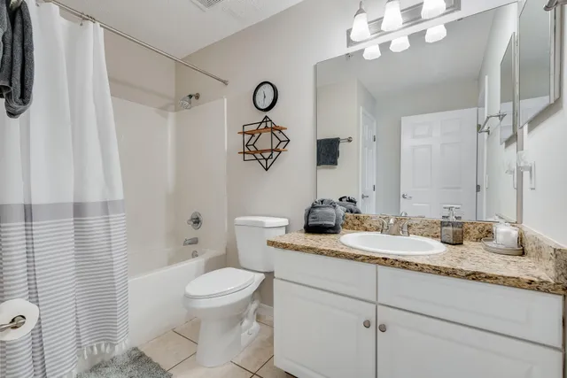 a bedroom with bed and a window