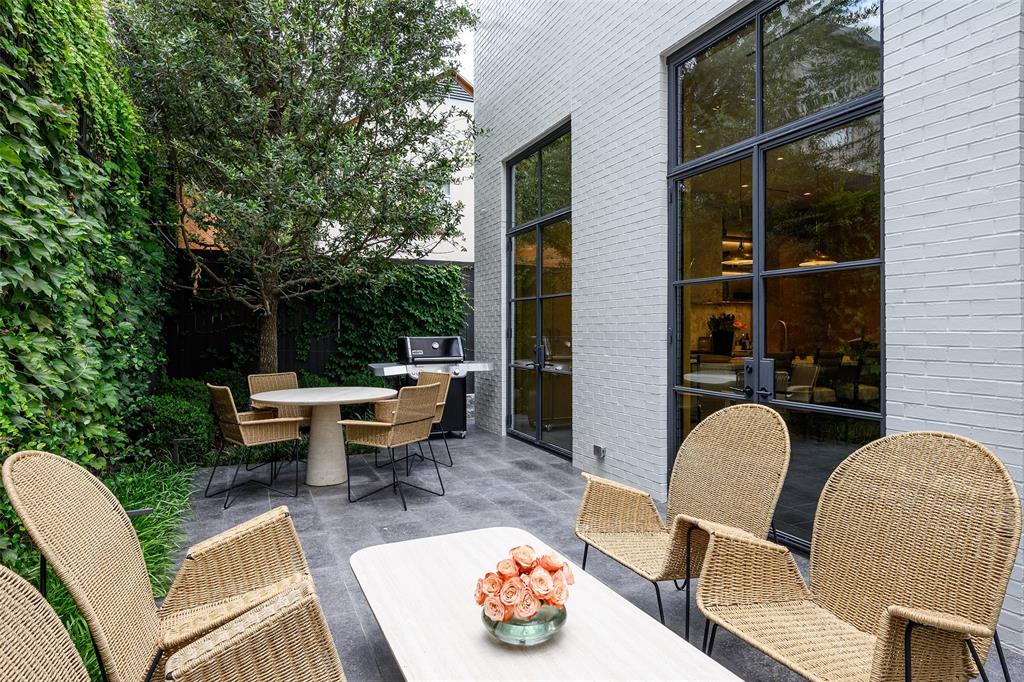 3511 Springbrook Street Dallas, TX 75205 - Photo 35 of 38 Private exterior patio featuring a paved surface, a built-in grill, and mature perimeter landscaping