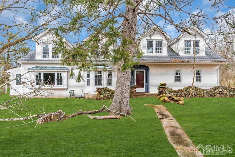 700 Foothill Road Bridgewater, NJ 08807 - Photo 1 of 30 a front view of a house with a garden and yard