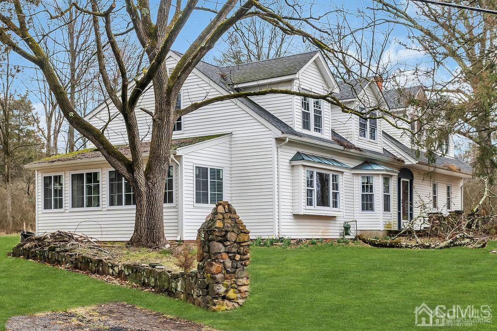 700 Foothill Road Bridgewater, NJ 08807 - Photo 3 of 30 a front view of a house with a garden