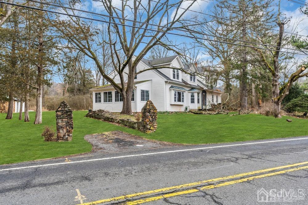 700 Foothill Road Bridgewater, NJ 08807 - Photo 4 of 30 a front view of a house with a yard and garage