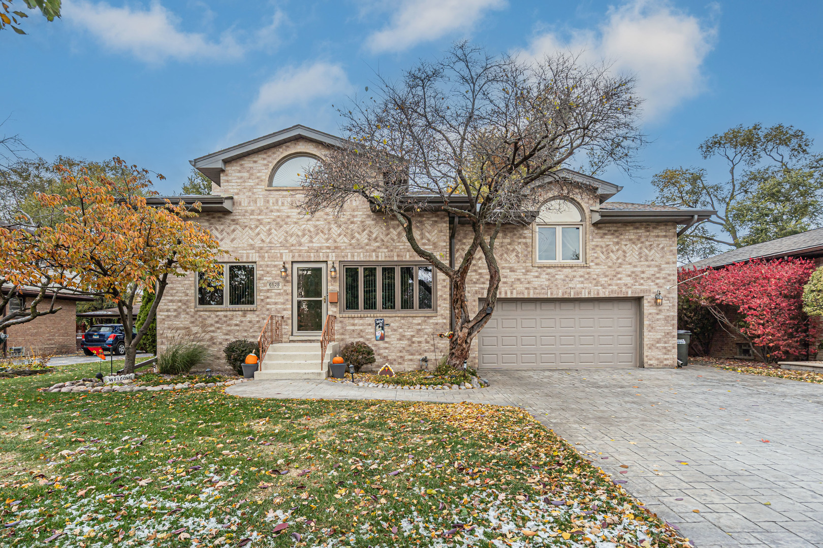 6528 Ridge Drive Chicago Ridge, IL 60415 - Photo 1 of 33 a front view of a house with a yard