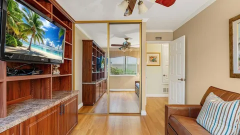 a view of kitchen with furniture and wooden floor