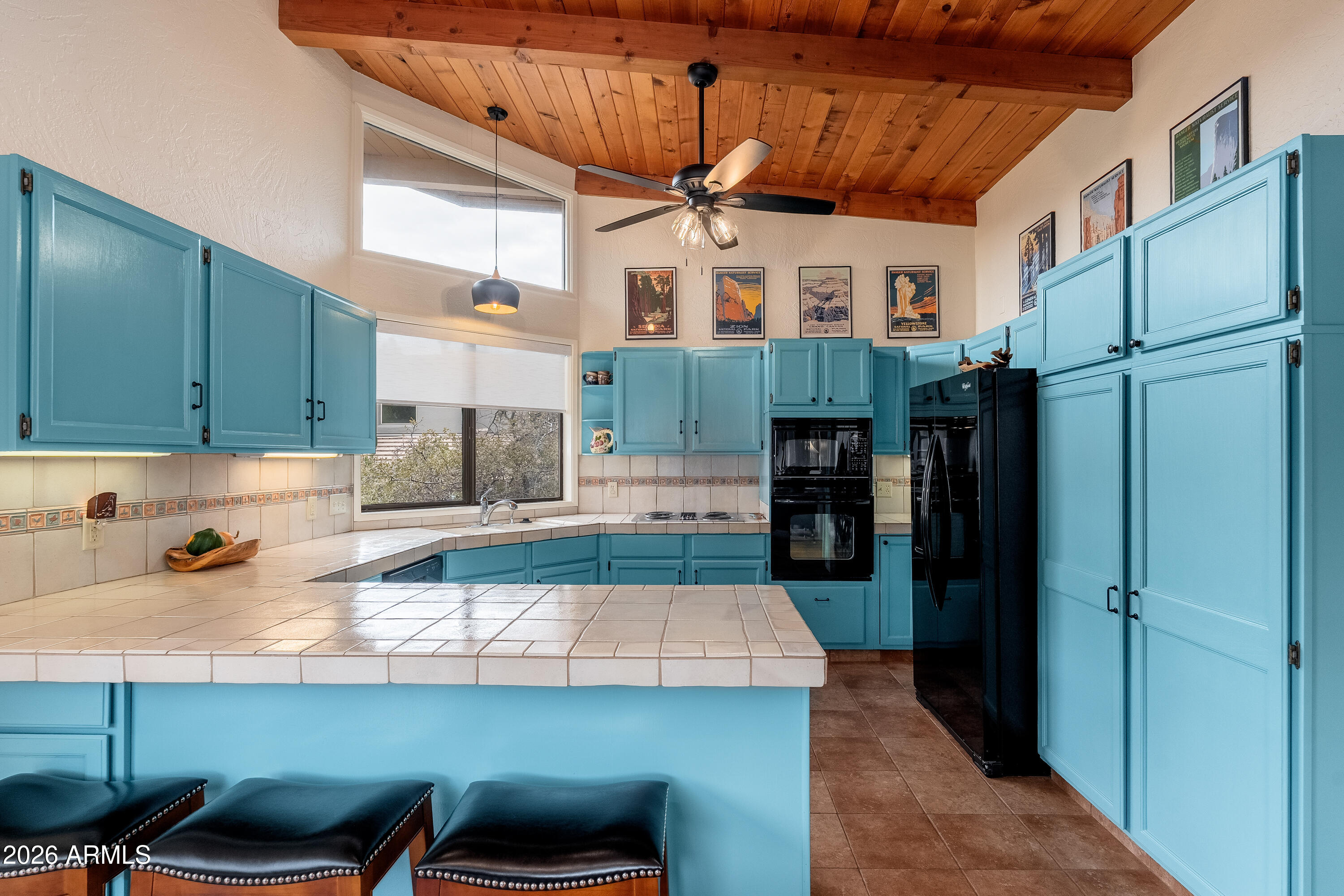30 Kashmir Road Sedona, AZ 86336 - Photo 13 of 57 a kitchen with stainless steel appliances granite countertop a sink and a refrigerator