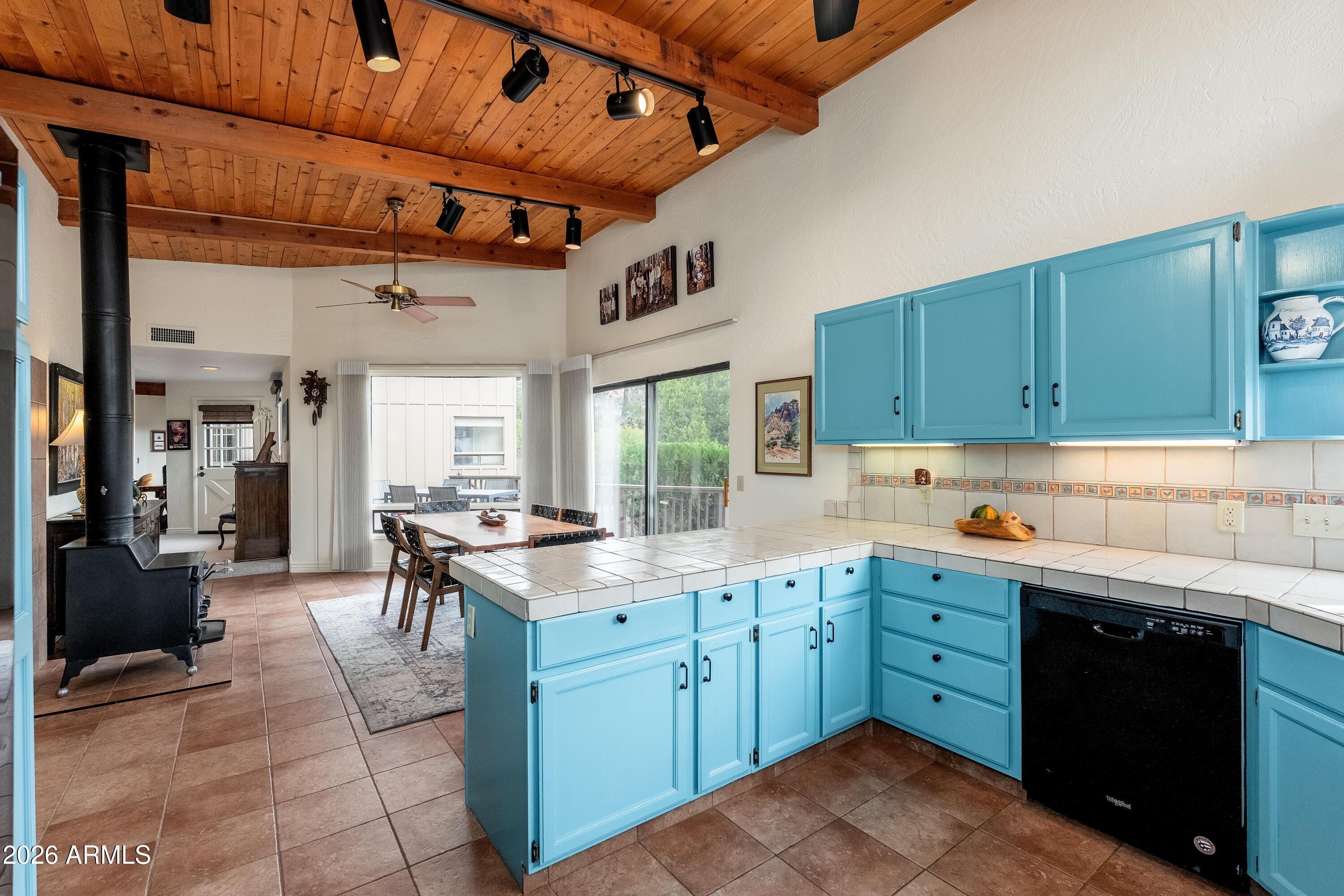 30 Kashmir Road Sedona, AZ 86336 - Photo 16 of 57 a kitchen with a sink a stove and cabinets