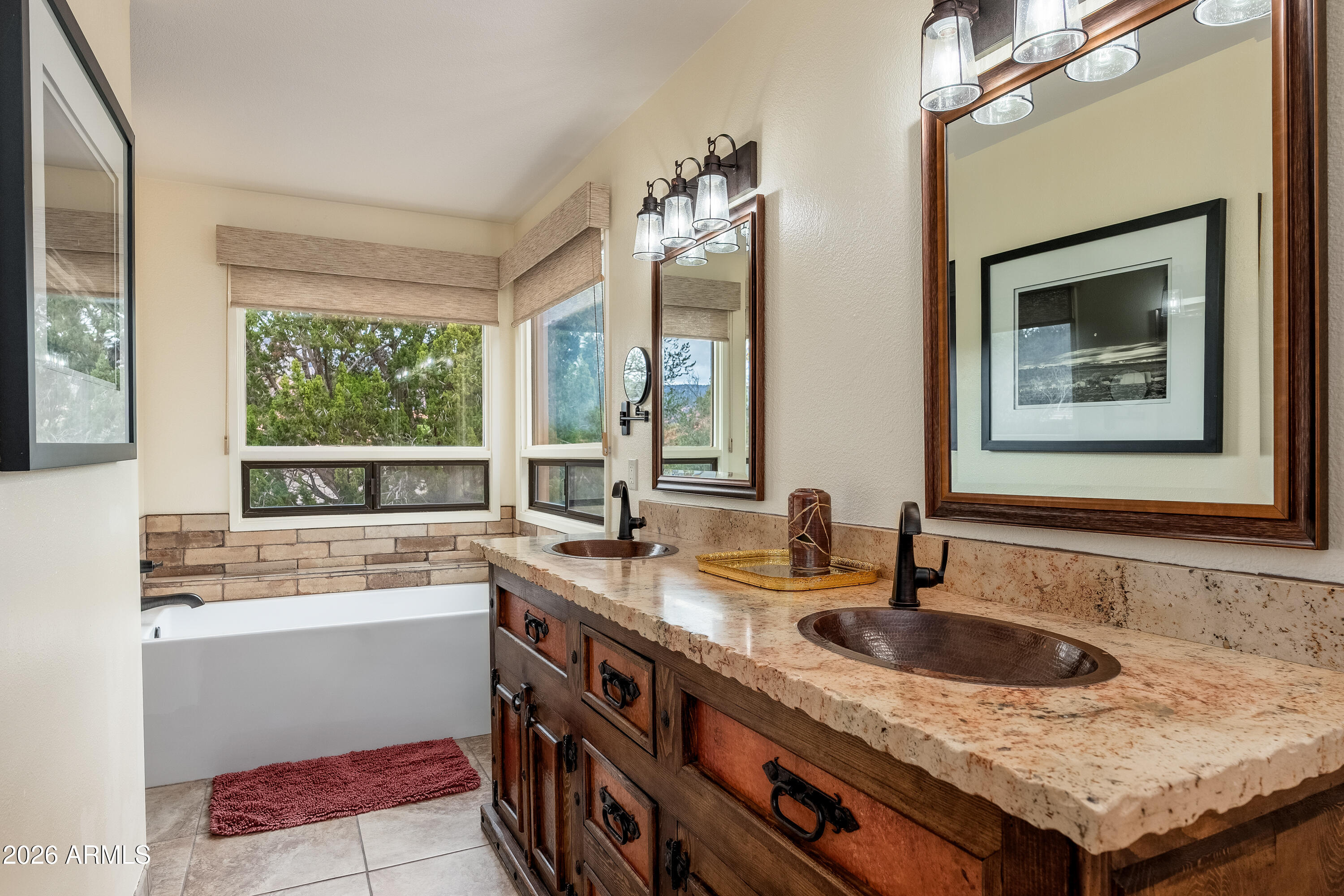 30 Kashmir Road Sedona, AZ 86336 - Photo 19 of 57 a bathroom with a granite countertop sink and a window
