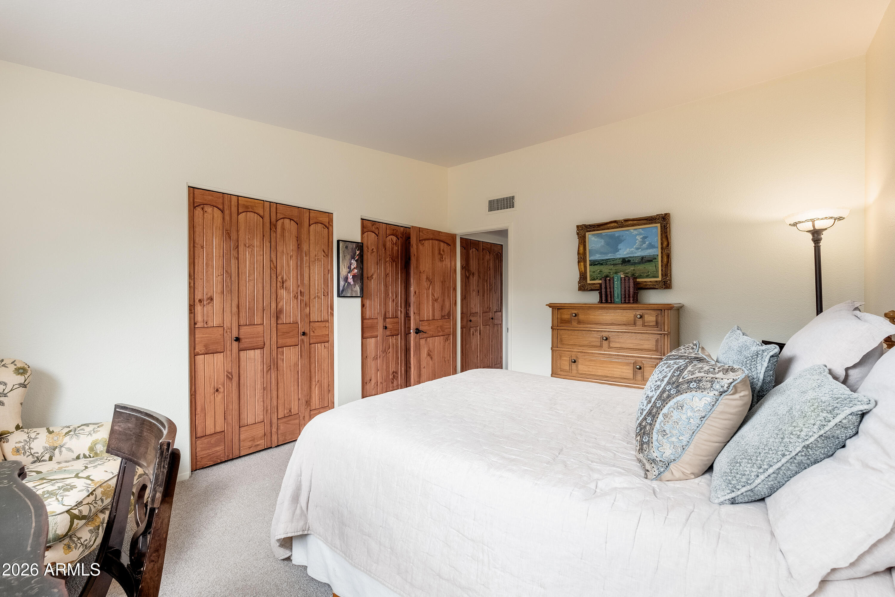 30 Kashmir Road Sedona, AZ 86336 - Photo 24 of 57 a bedroom with a bed and a dresser