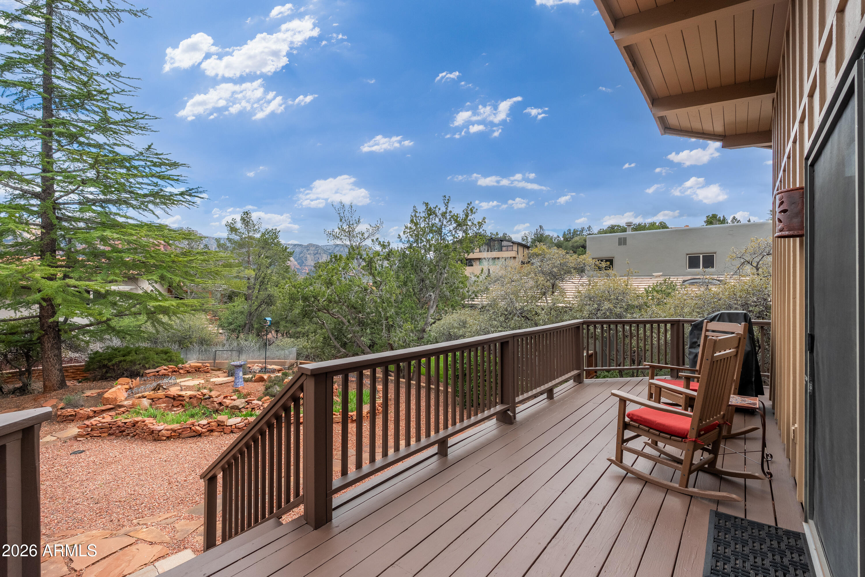 30 Kashmir Road Sedona, AZ 86336 - Photo 29 of 57 a balcony with wooden floor and city view