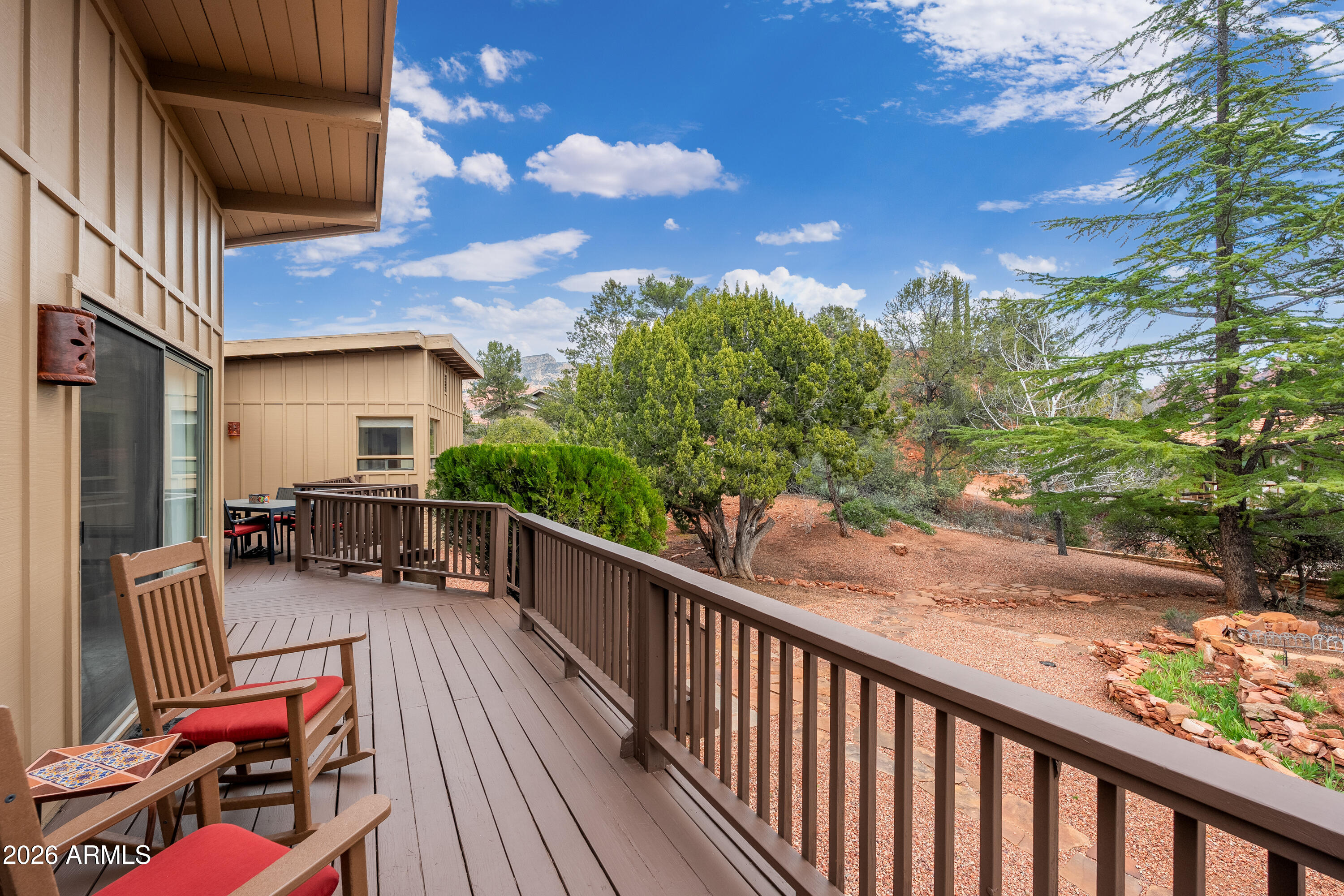 30 Kashmir Road Sedona, AZ 86336 - Photo 30 of 57 a view of balcony with chairs and wooden fence