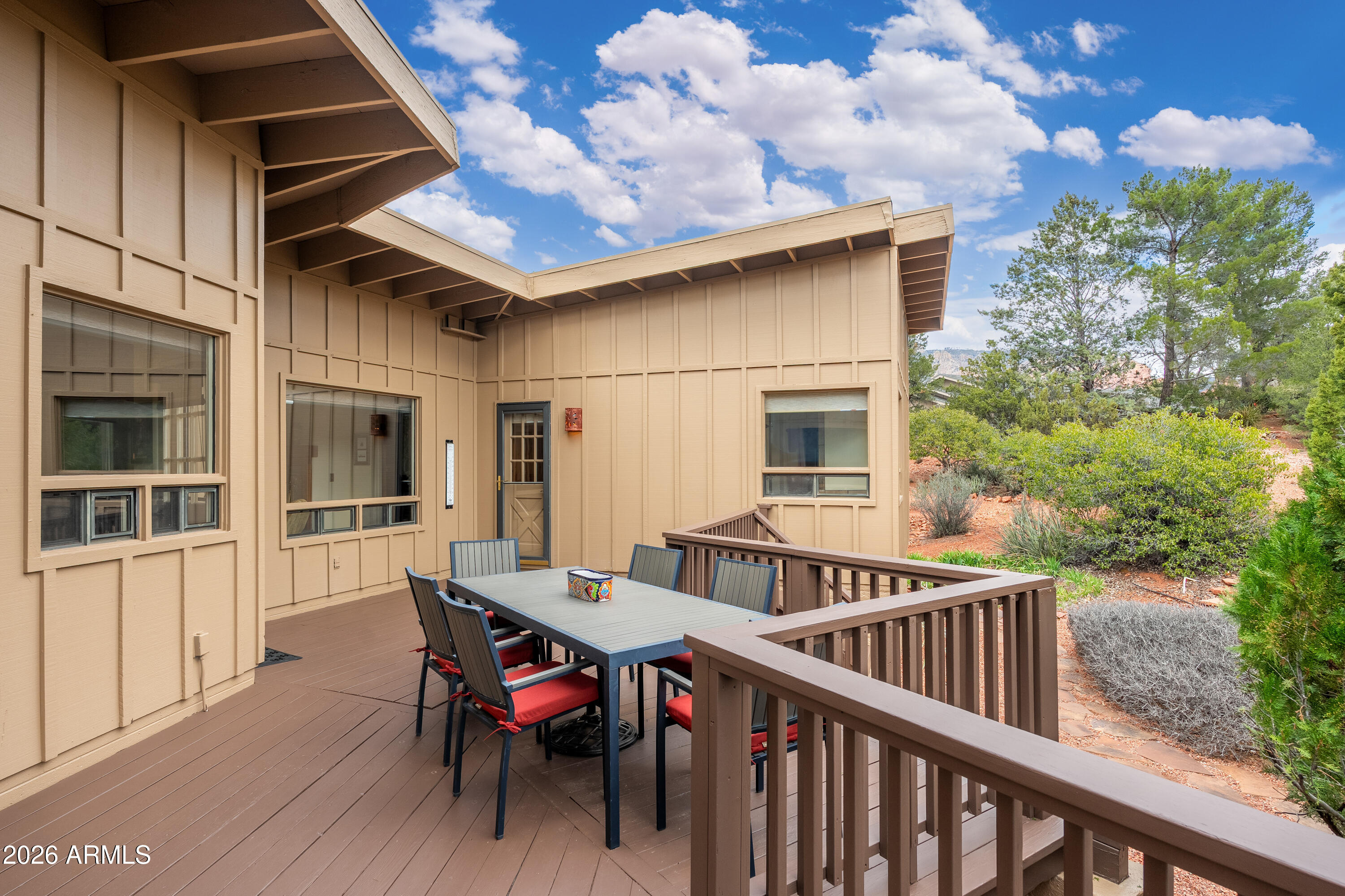 30 Kashmir Road Sedona, AZ 86336 - Photo 31 of 57 a view of a patio with table and chairs and potted plants