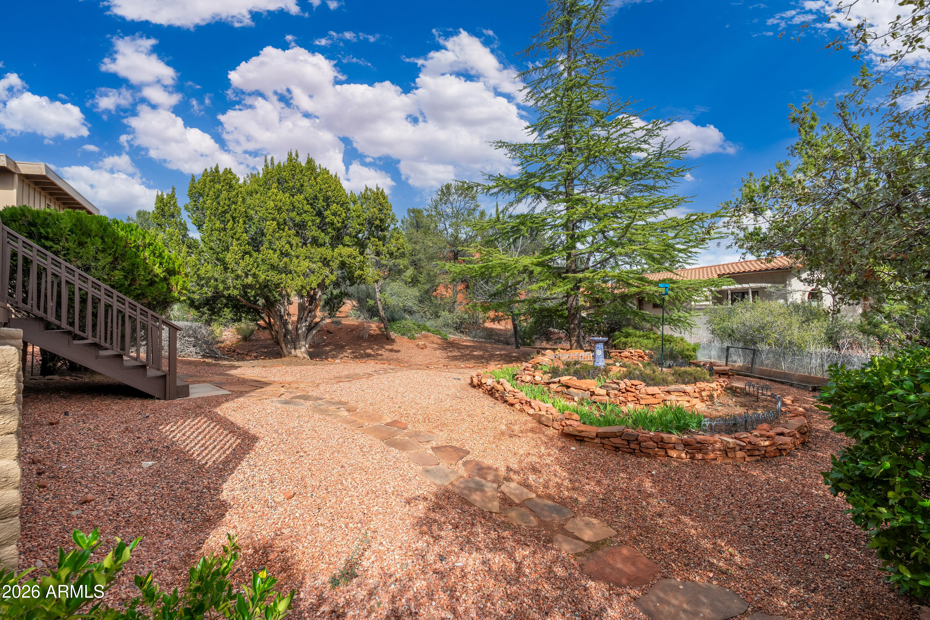 30 Kashmir Road Sedona, AZ 86336 - Photo 38 of 57 a backyard of a house with a yard and outdoor seating