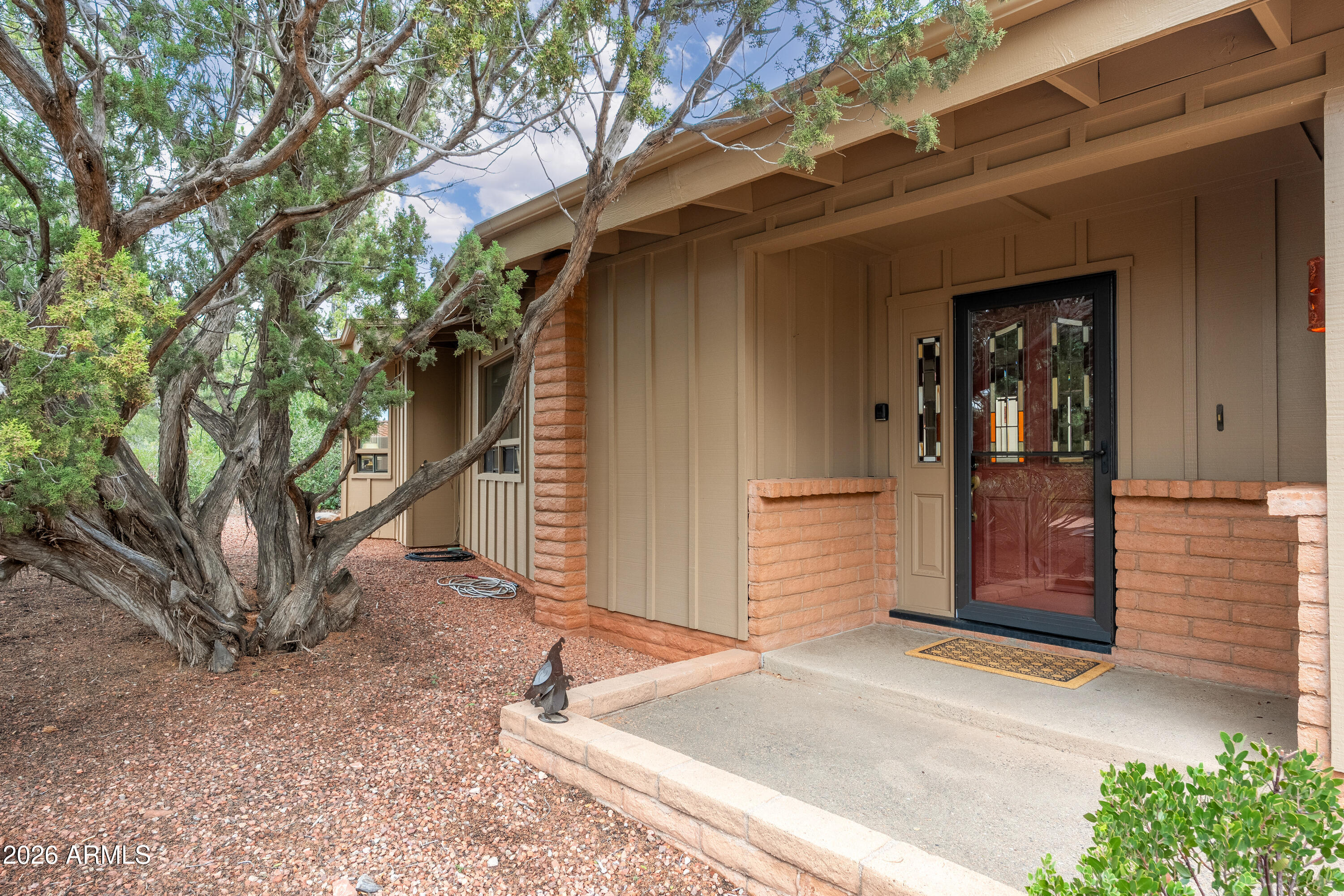 30 Kashmir Road Sedona, AZ 86336 - Photo 4 of 57 a front view of a house with a tree
