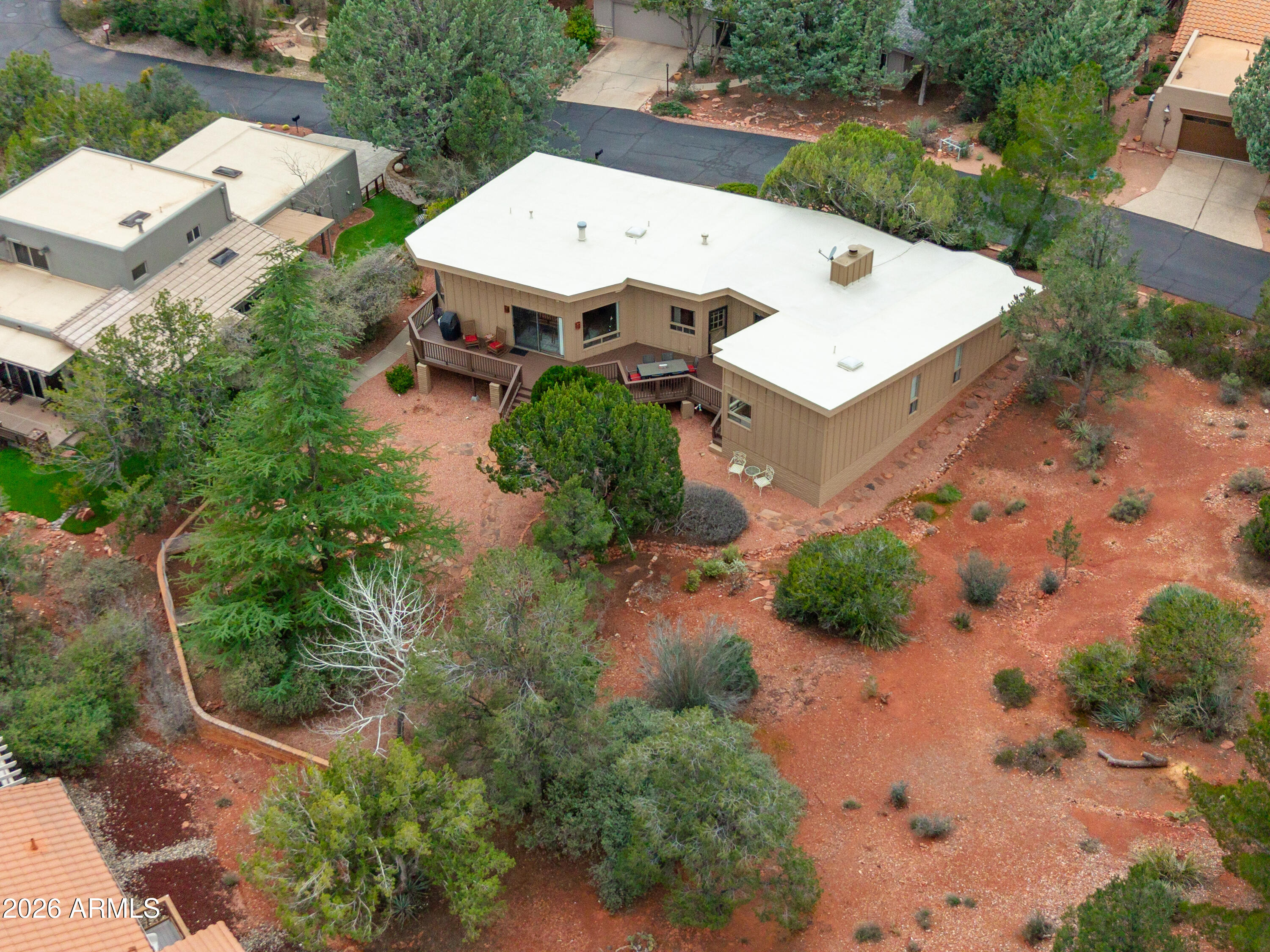 30 Kashmir Road Sedona, AZ 86336 - Photo 50 of 57 an aerial view of a house with a yard and greenery