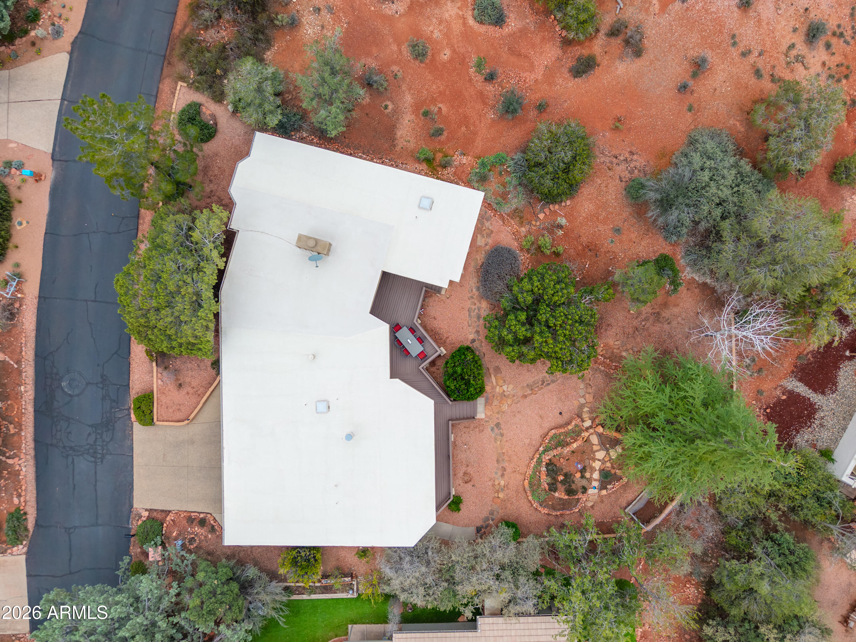 30 Kashmir Road Sedona, AZ 86336 - Photo 56 of 57 an aerial view of a house with garden space and street view