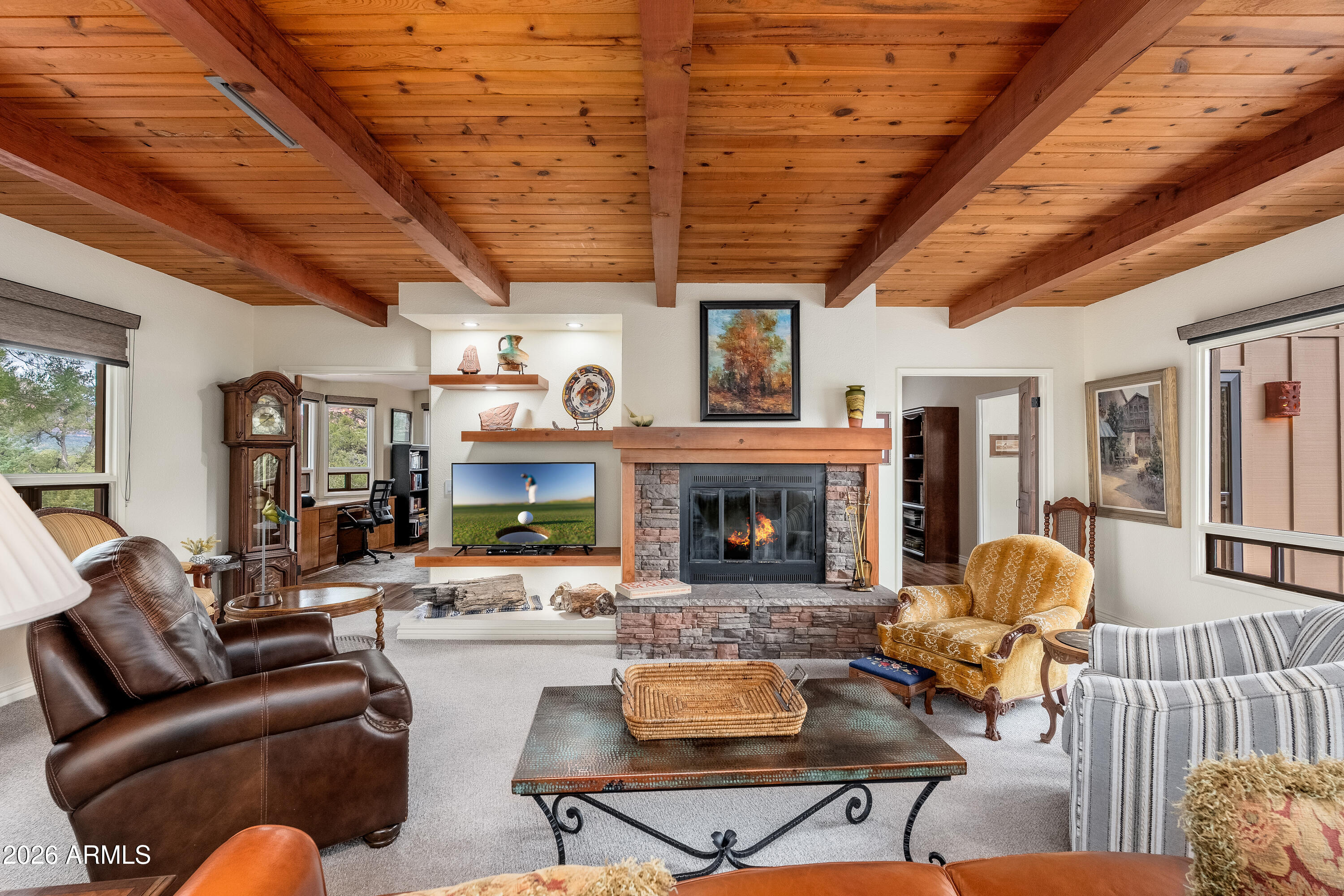 30 Kashmir Road Sedona, AZ 86336 - Photo 6 of 57 a living room with furniture and a fireplace