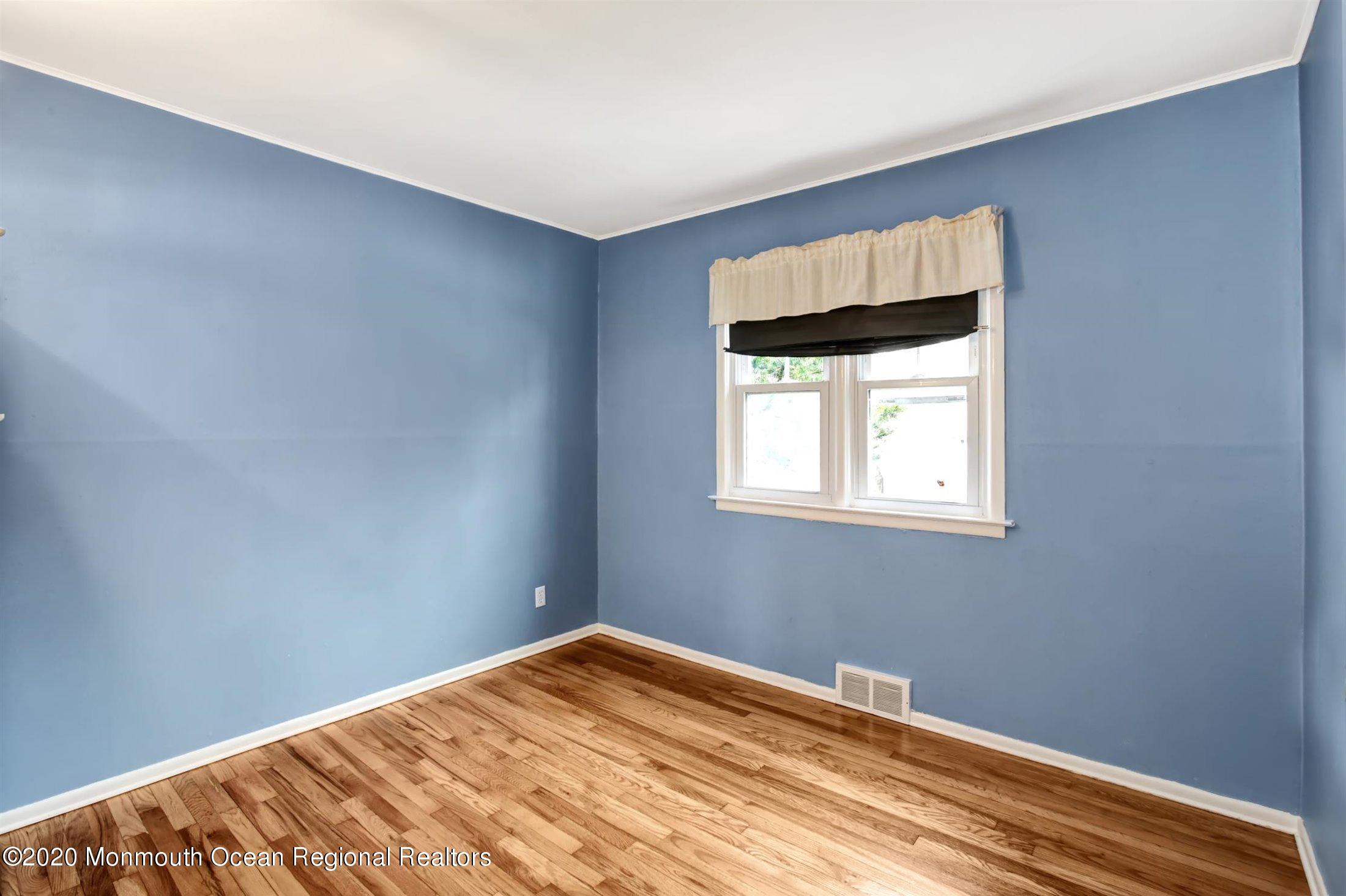 515 Couse Road Neptune Township, NJ 07753 - Photo 11 of 26 a view of a room with wooden floor and fan