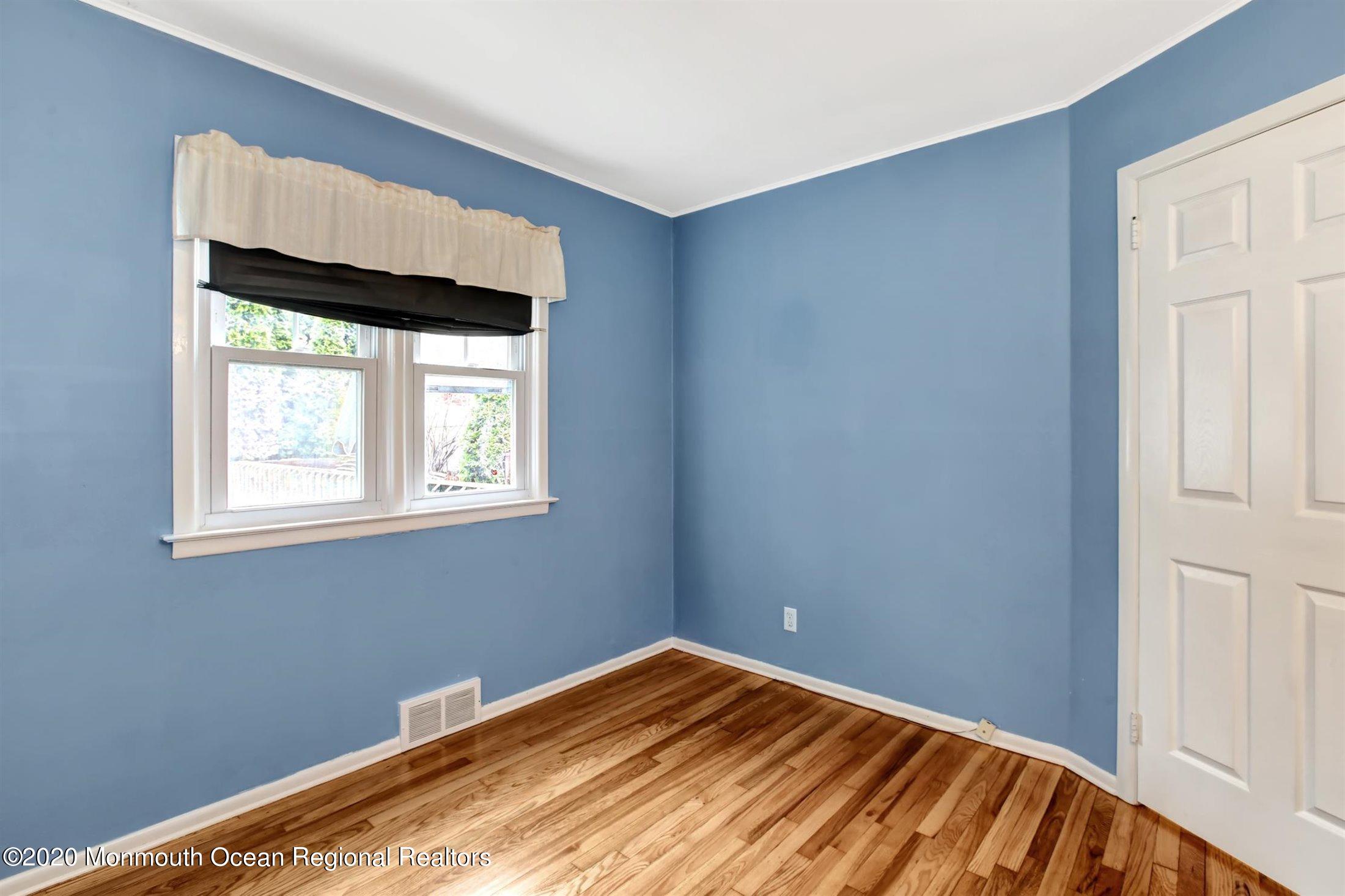 515 Couse Road Neptune Township, NJ 07753 - Photo 12 of 26 a view of room with window and hardwood floor