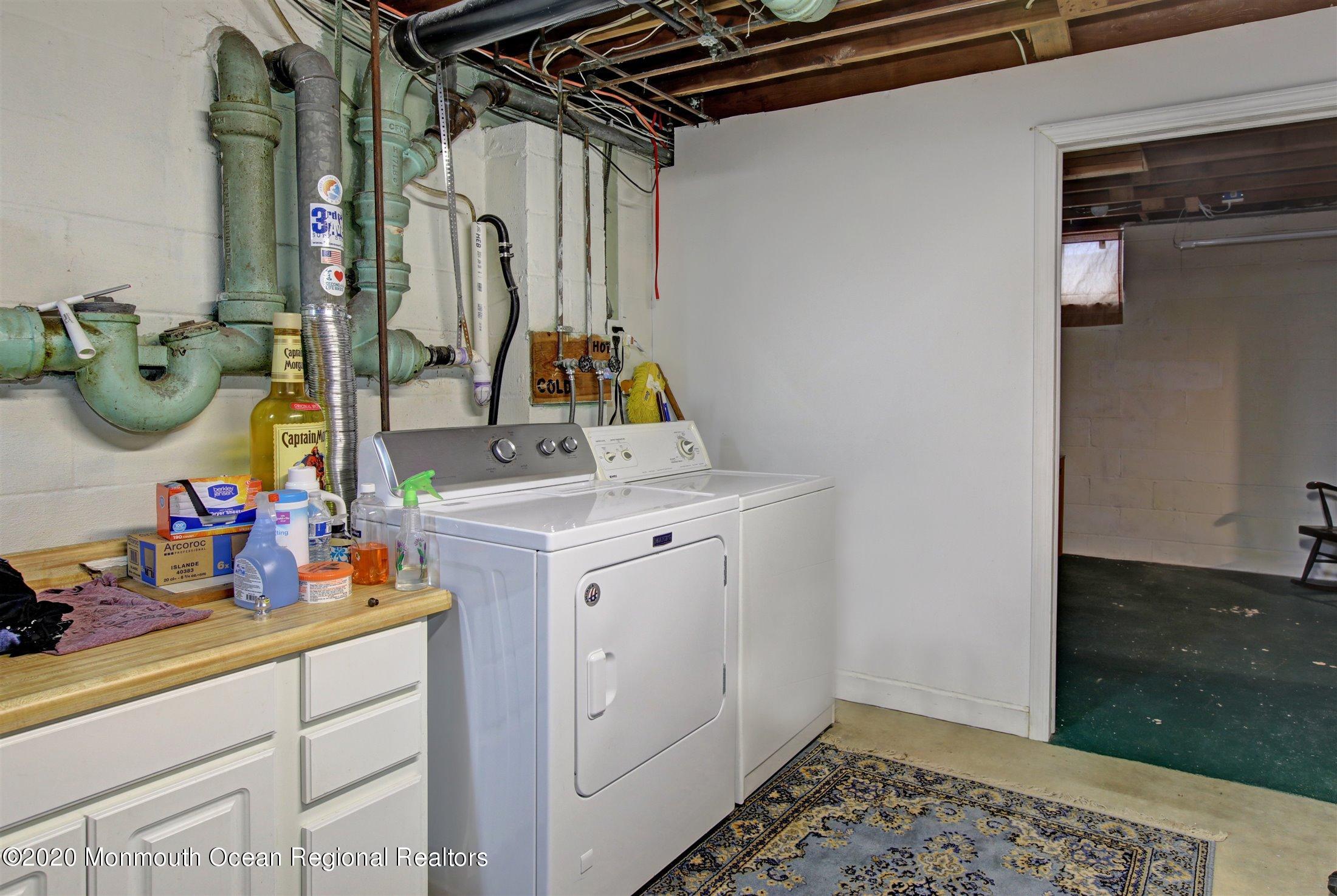 515 Couse Road Neptune Township, NJ 07753 - Photo 21 of 26 a utility room with dryer and washer