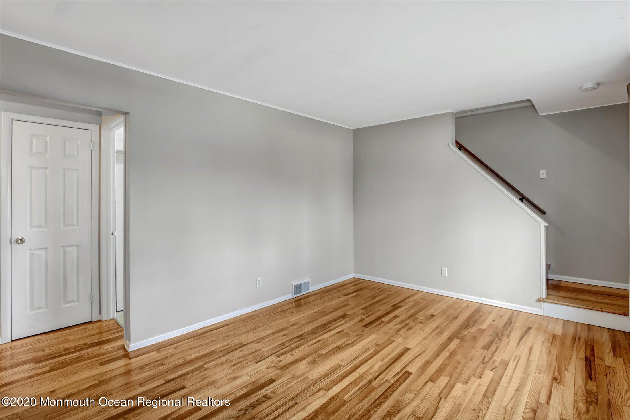 515 Couse Road Neptune Township, NJ 07753 - Photo 7 of 26 a view of empty room with wooden floor