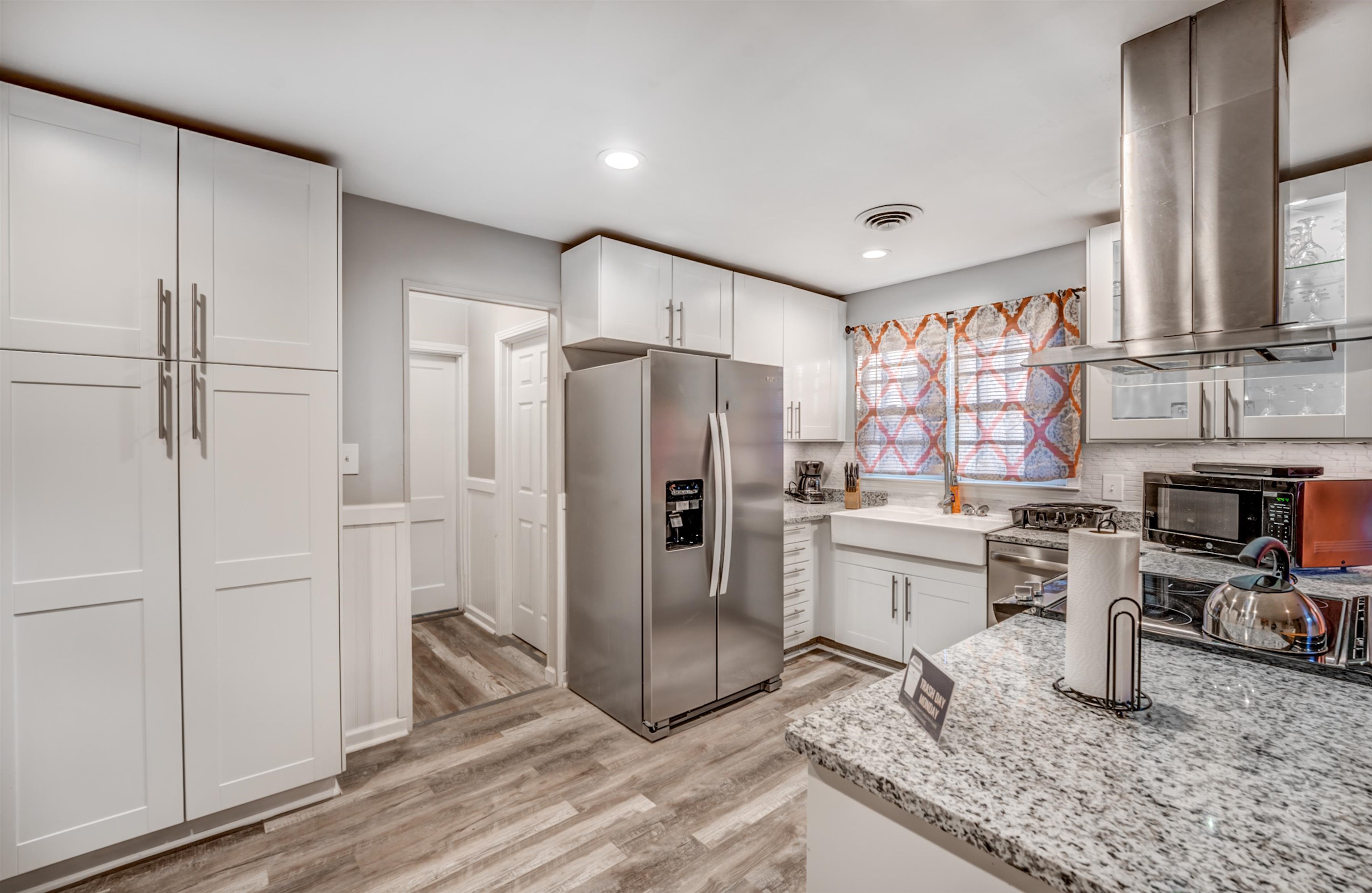 4493 Quince Road Memphis, TN 38117 - Photo 15 of 22 a kitchen with a refrigerator and a sink