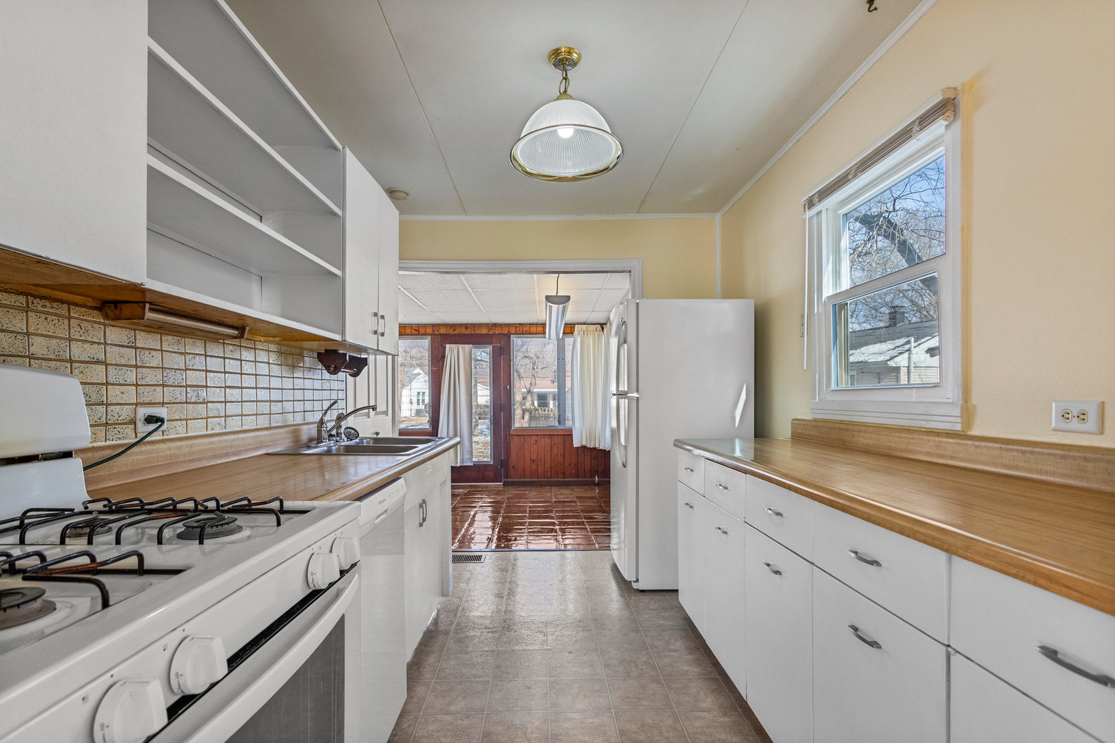 408 Maizefield Avenue Bloomington, IL 61701 - Photo 12 of 28 a kitchen with a sink stove and cabinets