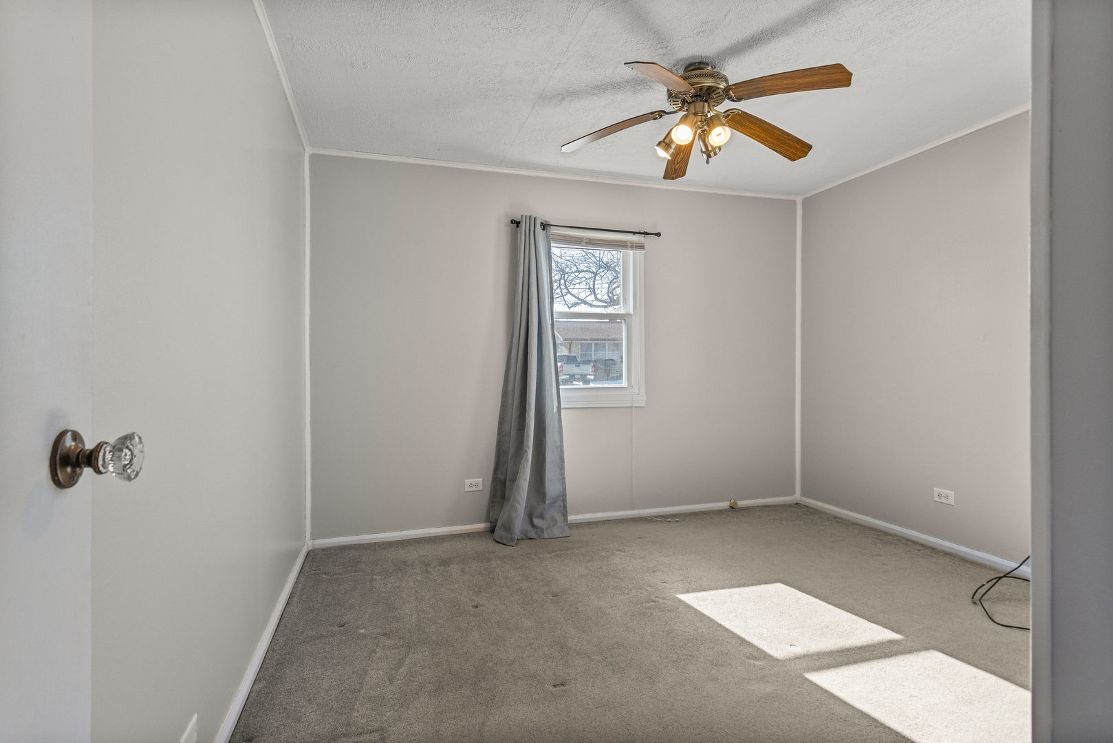 408 Maizefield Avenue Bloomington, IL 61701 - Photo 18 of 28 an empty room with closet and a chandelier fan