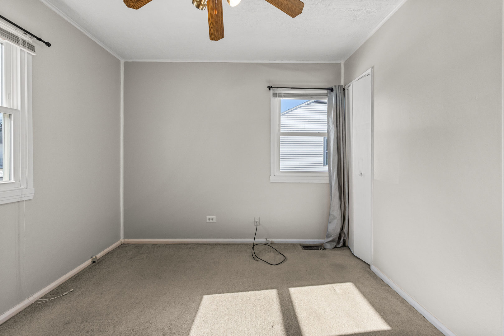408 Maizefield Avenue Bloomington, IL 61701 - Photo 19 of 28 a view of a room with exposed radiator and window