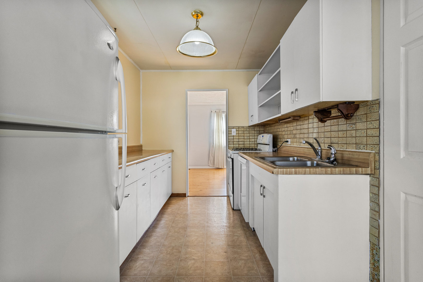 408 Maizefield Avenue Bloomington, IL 61701 - Photo 8 of 28 a kitchen with granite countertop a sink and a stove top oven