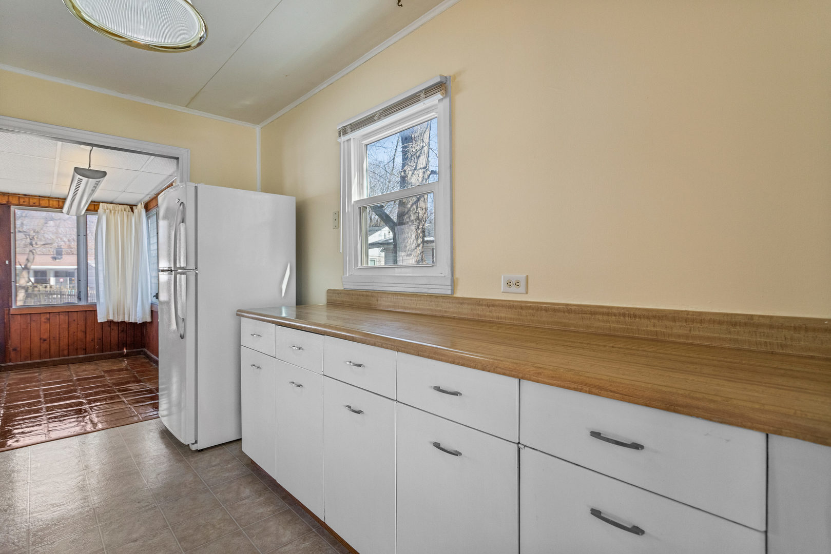 408 Maizefield Avenue Bloomington, IL 61701 - Photo 9 of 28 a view of cabinets with wooden floor
