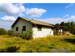 238 Gouges Branch Road Leicester, NC 28748 - Photo 2 of 23 a view of backyard of house with wooden floor
