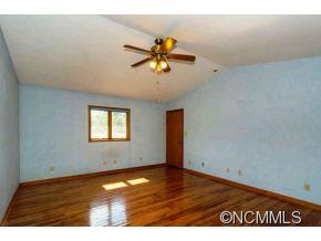 238 Gouges Branch Road Leicester, NC 28748 - Photo 11 of 23 a view of a room with a window and wooden floor