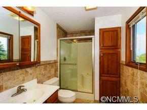 238 Gouges Branch Road Leicester, NC 28748 - Photo 13 of 23 a bathroom with a sink and a mirror