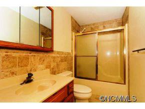 238 Gouges Branch Road Leicester, NC 28748 - Photo 15 of 23 a bathroom with a sink and a shower