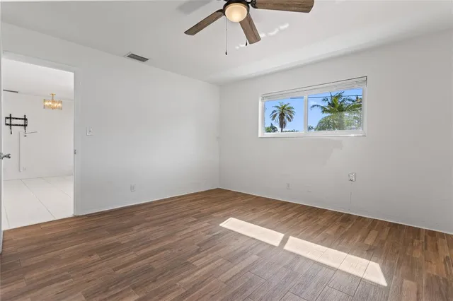 a view of a house with swimming pool and sitting area