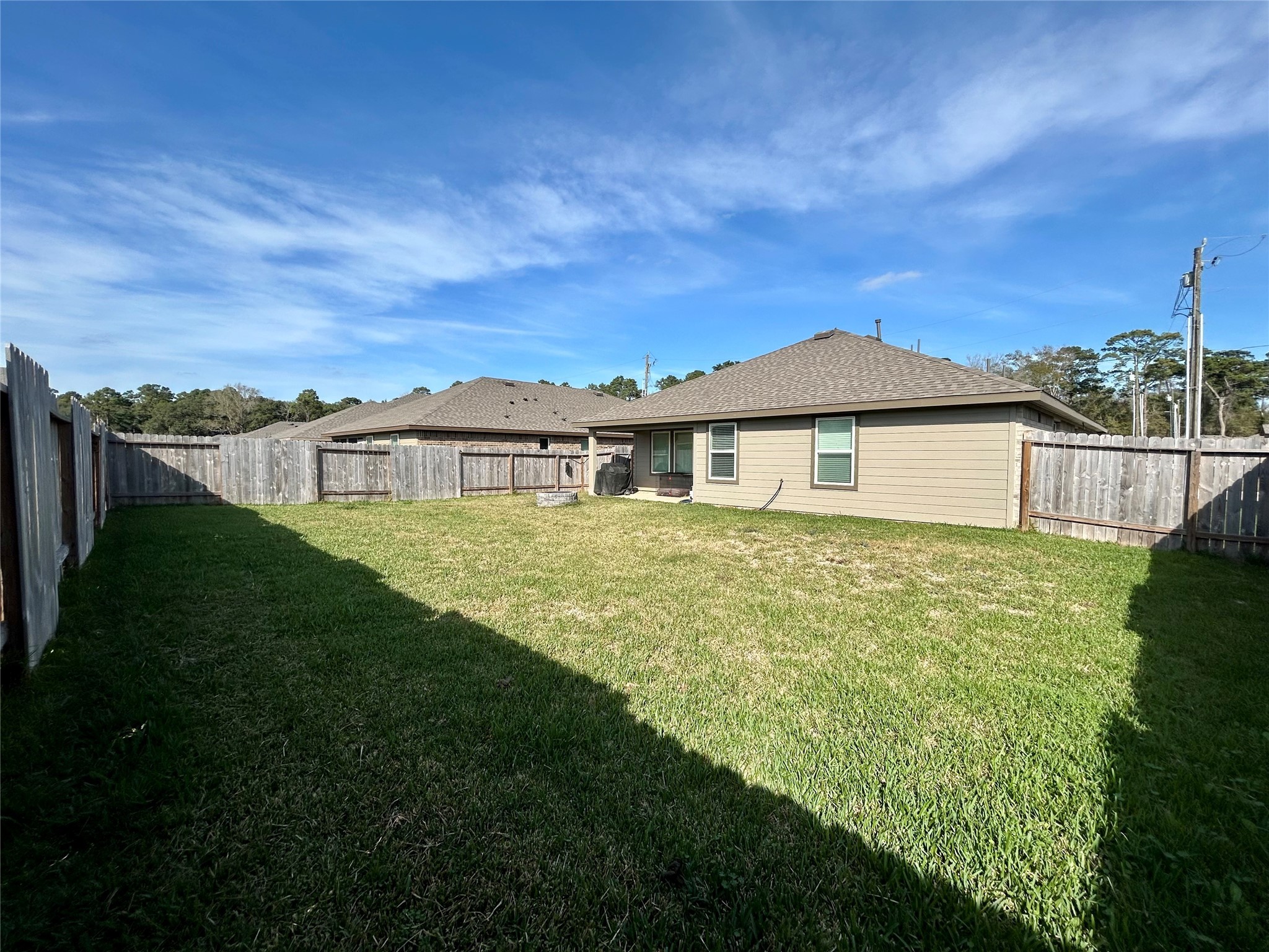 6515 Alexis Street Beaumont, TX 77708 - Photo 11 of 36 a front view of a house with a garden