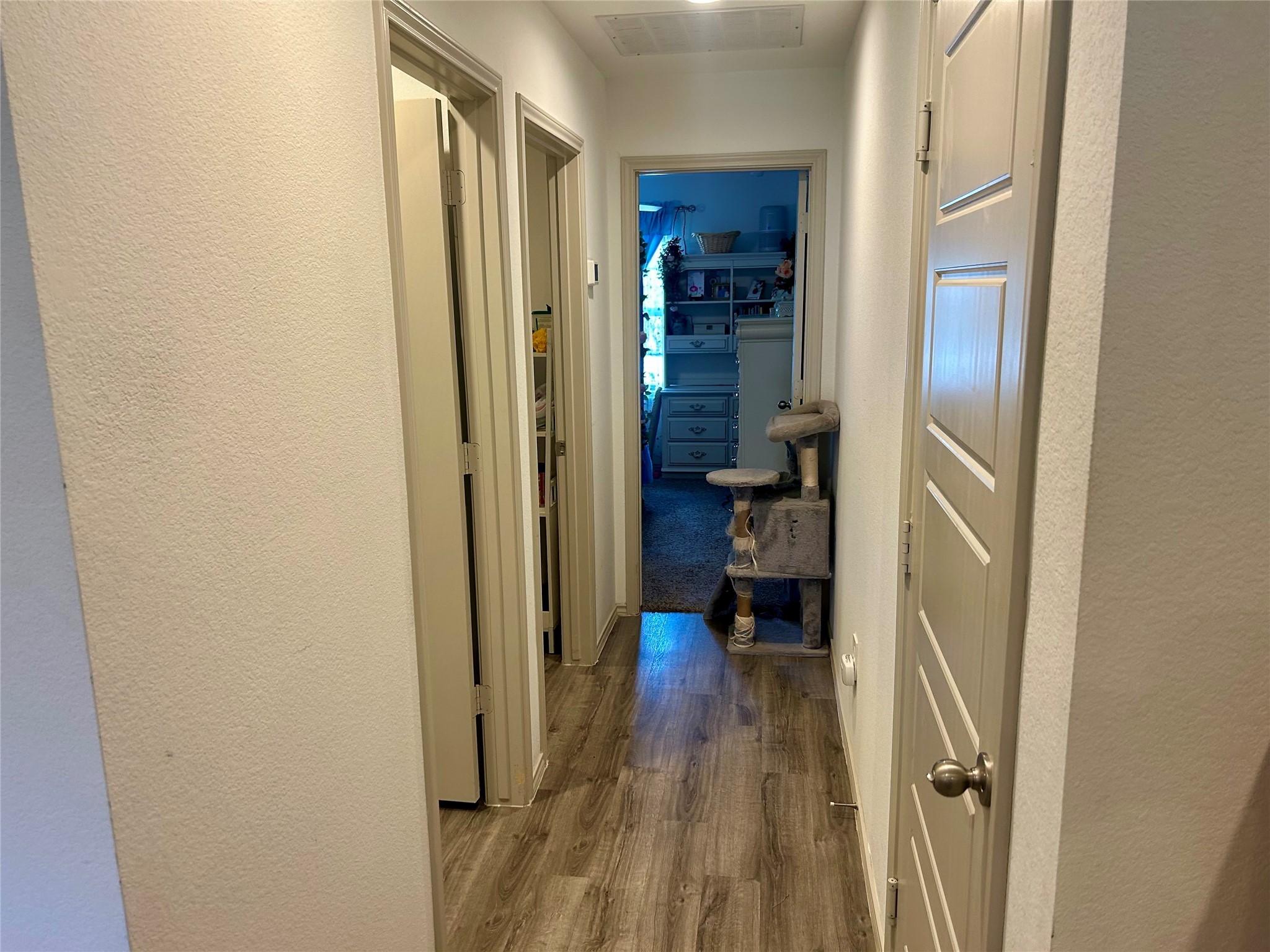 6515 Alexis Street Beaumont, TX 77708 - Photo 18 of 36 a view of a hallway with wooden floor and closet