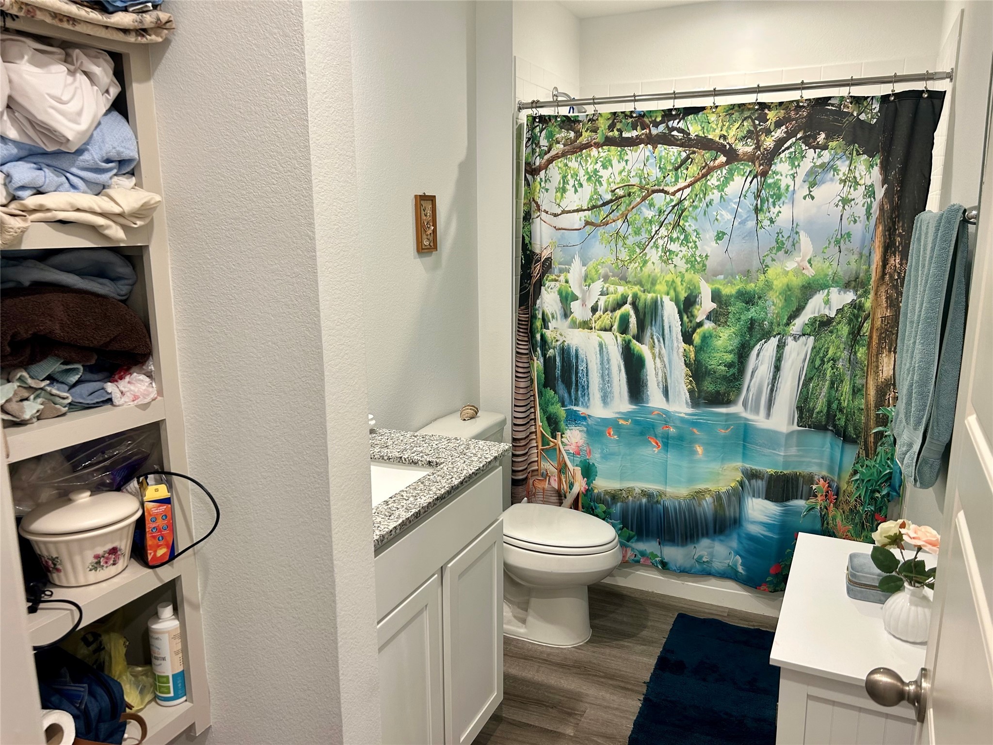 6515 Alexis Street Beaumont, TX 77708 - Photo 19 of 36 a bathroom with a toilet sink and mirror