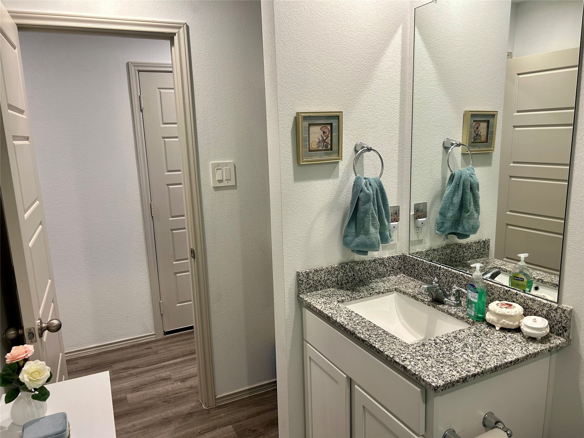 6515 Alexis Street Beaumont, TX 77708 - Photo 20 of 36 a bathroom with a granite countertop sink and a mirror